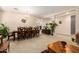 Open concept dining area with a large table and access to the living room at 45759 W Morning View Ln, Maricopa, AZ 85139