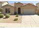 One-story house with a two-car garage and well-manicured front yard at 45759 W Morning View Ln, Maricopa, AZ 85139