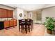 Kitchen features wood cabinets, tile floors, and a breakfast nook at 45759 W Morning View Ln, Maricopa, AZ 85139