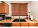 Functional kitchen with double sink, microwave, and ample counter space at 45759 W Morning View Ln, Maricopa, AZ 85139