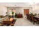 Living room with wood floors, comfy sofas, and a piano at 45759 W Morning View Ln, Maricopa, AZ 85139