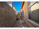 Side yard access with gate and gravel at 45759 W Morning View Ln, Maricopa, AZ 85139