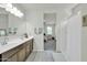 Double vanity bathroom with large mirror and walk-in shower at 4714 W Nutmeg Ave, Coolidge, AZ 85128