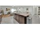 Spacious kitchen island with granite countertop and dark brown cabinets at 4714 W Nutmeg Ave, Coolidge, AZ 85128