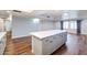 Modern kitchen with island, white countertops, and gray cabinets at 4715 N 64Th Ave, Phoenix, AZ 85033