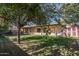 Home exterior and backyard with covered patio and storage shed at 5213 W Sweetwater Ave, Glendale, AZ 85304