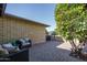 Brick patio with seating area and lush green tree at 5213 W Sweetwater Ave, Glendale, AZ 85304