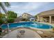 Inviting backyard oasis featuring a large pool, spa, and ample patio space at 6501 E Monte Cristo Ave, Scottsdale, AZ 85254