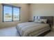Bright bedroom with large windows, mountain views, and a comfortable bed at 6816 E Stagecoach Pass Pass, Carefree, AZ 85377