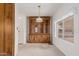 Dining area featuring a built-in hutch and light carpeting at 8140 E Cactus Dr, Mesa, AZ 85208