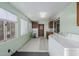 Laundry room with washer, dryer, and built-in cabinets at 8140 E Cactus Dr, Mesa, AZ 85208