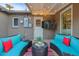 Cozy patio with teal seating and string lights at 8450 E Montecito Ave, Scottsdale, AZ 85251