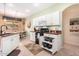 Well-equipped kitchen with white cabinets and granite counters at 17963 W Ryans Way, Surprise, AZ 85374