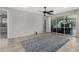 Bright and airy living room with sliding glass doors leading to the patio at 18625 W Elm St, Goodyear, AZ 85395