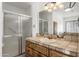 Bathroom with a wooden vanity, tiled flooring, and a shower/tub combo at 1965 Diamondback Dr, Wickenburg, AZ 85390