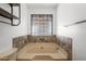 Bathroom with a built-in bathtub and a block window for natural light at 1965 Diamondback Dr, Wickenburg, AZ 85390