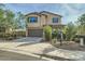 Two-story house with a landscaped yard and driveway at 2039 N 213Th Ln, Buckeye, AZ 85396