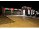 Two-car garage with decorative lighting at night at 2109 W Samantha Way, Phoenix, AZ 85041