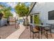Landscaped backyard pathway leading to a pool and patio area at 2328 N Roca St, Mesa, AZ 85213