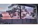 Peaceful backyard with a sunset view over a block wall at 2328 N Roca St, Mesa, AZ 85213
