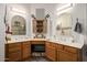 Double vanity bathroom with a large mirror and updated cabinetry at 2328 N Roca St, Mesa, AZ 85213