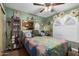 Charming bedroom with unique wall decor and a comfortable bed at 2328 N Roca St, Mesa, AZ 85213
