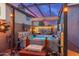 Relax in this covered hot tub, complete with pergola and ambient lighting at 2328 N Roca St, Mesa, AZ 85213