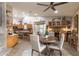 Kitchen with island, wood cabinets, and dining area at 2328 N Roca St, Mesa, AZ 85213