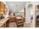 L-Shaped kitchen with wood cabinets and a breakfast bar at 2328 N Roca St, Mesa, AZ 85213