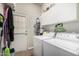 Convenient laundry room with washer, dryer, and extra storage at 2328 N Roca St, Mesa, AZ 85213