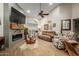 Spacious living room with fireplace, hardwood floors, and comfortable furniture at 2328 N Roca St, Mesa, AZ 85213