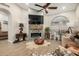 Living room with fireplace, large TV, and comfortable seating at 2328 N Roca St, Mesa, AZ 85213