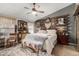 Large main bedroom with rustic wall decor and comfortable bedding at 2328 N Roca St, Mesa, AZ 85213