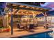 Covered patio area with seating and Route 66 theme at 2328 N Roca St, Mesa, AZ 85213