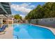 Sparkling blue pool with surrounding patio and lounge chairs at 2328 N Roca St, Mesa, AZ 85213