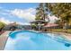 Inviting swimming pool with a Route 66 mural and covered patio at 2328 N Roca St, Mesa, AZ 85213