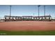 Well-maintained softball field with covered seating at 2699 N Riverside Dr, Florence, AZ 85132