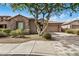 Single-story home with stone accents and a two-car garage at 29214 N 19Th Ln, Phoenix, AZ 85085