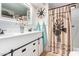 Bathroom with double vanity, large mirror, and farmhouse-style decor at 3104 E Broadway Rd # 22, Mesa, AZ 85204