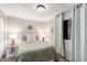 Cozy bedroom with floral bedding, nightstands, and window curtains at 3104 E Broadway Rd # 22, Mesa, AZ 85204