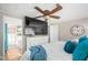 Main bedroom features a large TV, dresser and ensuite bathroom access at 3104 E Broadway Rd # 22, Mesa, AZ 85204
