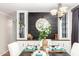 Bright dining room features a built-in hutch and a large clock on a dark wall at 3104 E Broadway Rd # 22, Mesa, AZ 85204