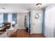Bright and airy entryway with hardwood floors and a charming door at 3104 E Broadway Rd # 22, Mesa, AZ 85204