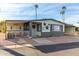 Inviting exterior of a manufactured home with a covered porch and landscaped yard at 3104 E Broadway Rd # 22, Mesa, AZ 85204