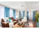Living area with hardwood floors, leather seating, and large windows at 3104 E Broadway Rd # 22, Mesa, AZ 85204