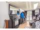 Living room with fireplace, mirror, and access to backyard at 3104 E Broadway Rd # 22, Mesa, AZ 85204