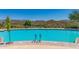 Resort-style pool with plenty of lounge chairs at 41120 N Congressional Dr, Anthem, AZ 85086