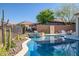 Relaxing pool and spa area with desert landscaping at 41120 N Congressional Dr, Anthem, AZ 85086