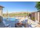 Relaxing backyard with pool, spa, fire pit, and mountain views at 41120 N Congressional Dr, Anthem, AZ 85086