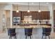 Kitchen island with granite countertops and dark wood cabinets at 4315 W Agave Ave, Eloy, AZ 85131